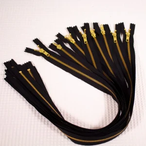 Fermeture éclair YKK métal non séparable noir, maille dorée 5mm
